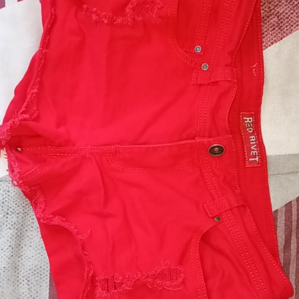Red Rivet jean shorts size 11 color red.